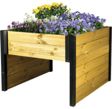 Carré potager surélevé en bois avec poteaux d angle noirs et fleurs.