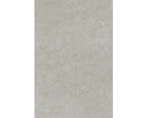 Surface de carrelage en grès cérame aspect pierre avec grain fin.