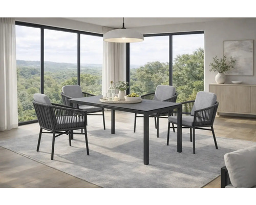 Moderner Essbereich mit dunklem rechteckigem Tisch und vier Armlehnstühlen mit Seilbespannung und grauen Polstern vor grossen Fensterfronten.