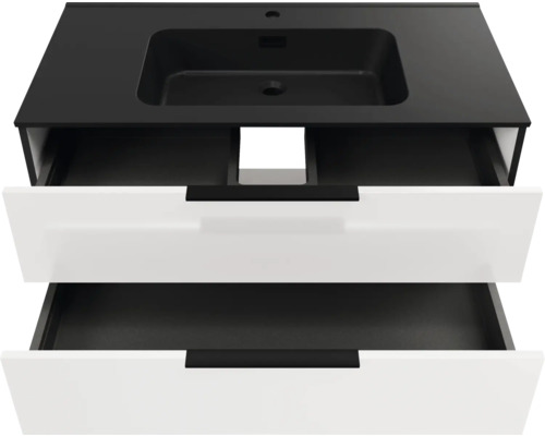 Waschtischunterschrank mit zwei geöffneten Schubladen, schwarzem Waschtisch mit integriertem Waschbecken und weißen Fronten.