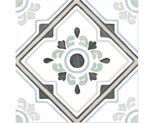 Carreau décoratif avec un motif ornemental symétrique, un motif floral central et une bordure en forme de losange.