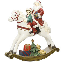 Weihnachtsfigur Weihnachtsmann und Kind auf einem weißen Schaukelpferd. Mit Tannenbaum, Geschenken und Teddybär am Sockel.