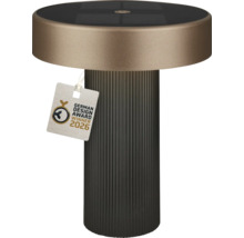 Lampe de table solaire moderne avec socle nervuré, abat-jour rond plat, panneau solaire intégré et German Design Award Winner 2026.