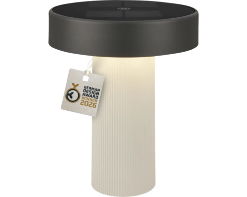 Lampe de table solaire cylindrique avec base blanche striée et partie supérieure foncée, sceau German Design Award Winner 2026.