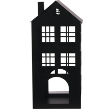 Lanterne noire en métal en forme de maison avec plusieurs fenêtres et une ouverture en arcade.