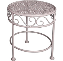 Runder weisser Beistelltisch aus Metall für den Garten mit Ornamenten und gitterartiger Tischplatte.