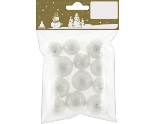 Petites boules de Noël blanches en plastique avec des paillettes dans un sachet de Geroma.