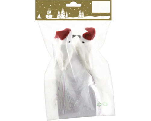 Zwei weiße Dekovögel mit roten Weihnachtsmannmützen und Federschwänzen in einer Verpackung.