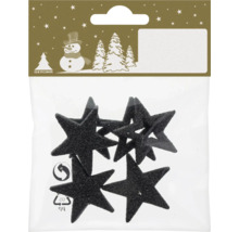 Schwarze Glitzersterne als Weihnachtsdekoration in einer Verpackung mit Geroma Logo.