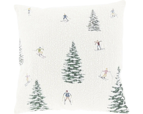 Coussin décoratif carré avec motif hivernal tissé composé de sapins et de skieurs.