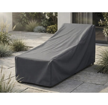 Housse de protection pour bain de soleil anthracite sur une terrasse pavée dans un jardin.