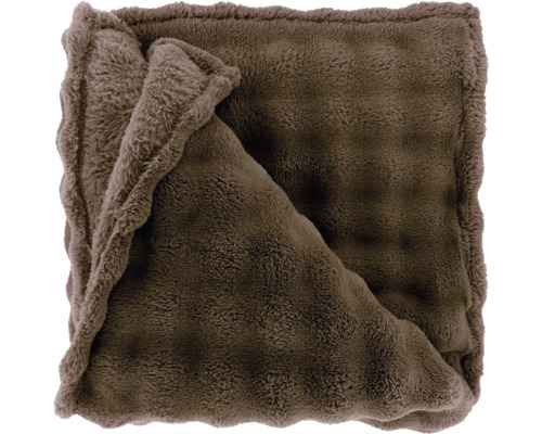 Couverture douce en fausse fourrure de couleur marron.