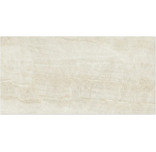 Carreau en grès cérame aspect pierre naturelle beige, surface structurée.