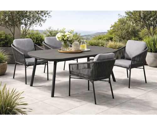 Ensemble de jardin composé d une table ovale sombre et de quatre fauteuils en corde grise avec coussins gris clair sur une terrasse lumineuse.