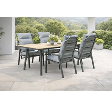 Ensemble de jardin moderne avec une table en bois et métal et quatre chaises dotées de coussins gris sur une terrasse en pierre claire.