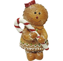 Lebkuchen-Mädchen Figur mit Zuckerstange und Schleife, glitzernde Weihnachtsdekoration.