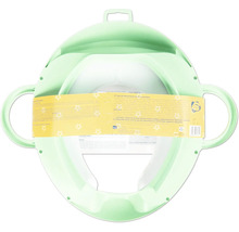 Réducteur de toilette vert pour enfants avec poignées latérales et un pare-éclaboussures.