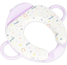 Réducteur de toilette rembourré pour enfants avec poignées latérales et motifs d'animaux.