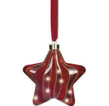 Décoration de Noël en verre en forme d'étoile avec des rayures ondulées rouges et dorées, suspendue à un ruban de velours rouge.