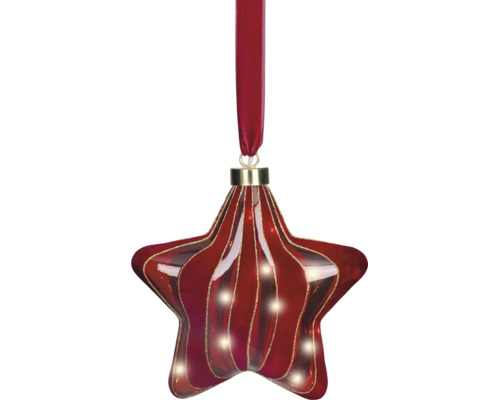 Décoration de Noël en verre en forme d'étoile avec des rayures ondulées rouges et dorées, suspendue à un ruban de velours rouge.