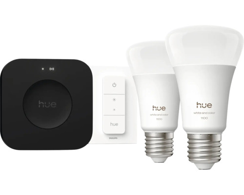 Philips Hue Starter Set mit Bridge, Dimmer Schalter und zwei White and Color Ambiance 1100 LED Leuchtmitteln E27. Philips Logo und Hue Logo.