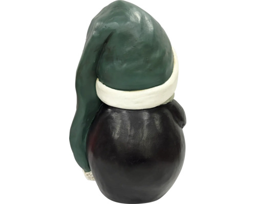 Rückansicht einer Weihnachtsfigur, Wichtel mit Mütze und rundem Körper.