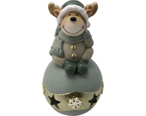 Figurine de renne décorative avec bonnet, écharpe et mitaines sur un socle rond avec étoiles et motif de flocon de neige.