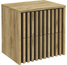Meuble sous-vasque aspect bois avec lamelles verticales sur la face avant.