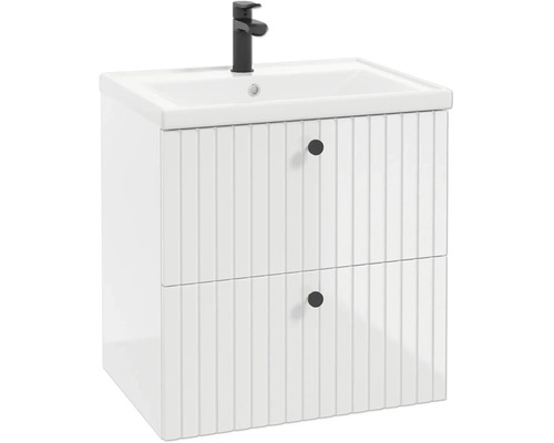 Weisser Waschbeckenunterschrank mit zwei Schubladen im Rillendesign, runden Knöpfen und weissem Waschtisch mit schwarzer Armatur.