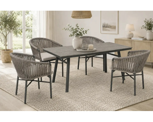 Salon de jardin moderne comprenant une table rectangulaire et quatre fauteuils en corde tressée avec coussins dans un espace de vie lumineux.