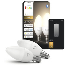 Deux ampoules LED Philips Hue White E14 en forme de bougie avec emballage et smartphone pour contrôle par application, 470 lumens.