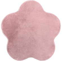 Tapis en forme de fleur en peluche douce de couleur rose.