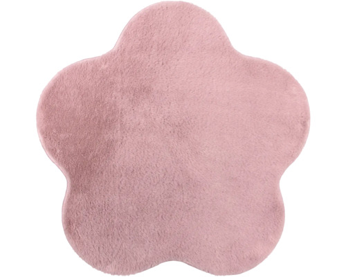 Tapis en forme de fleur en peluche douce de couleur rose.