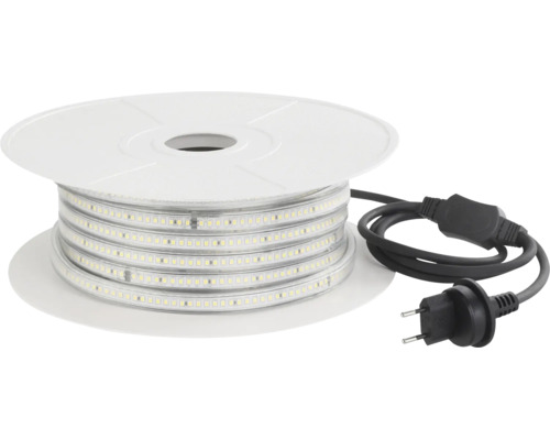 Ruban LED sur une bobine en plastique avec fiche secteur et câble de raccordement.