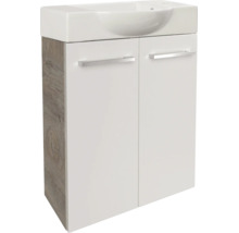 Meuble sous-vasque avec deux portes, corps en décor chêne, façades en blanc, avec lavabo en céramique.