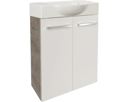Meuble sous-vasque avec deux portes, corps en décor chêne, façades en blanc, avec lavabo en céramique.