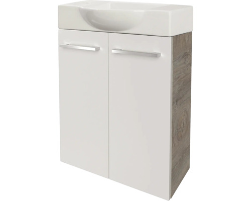 Meuble sous-lavabo avec deux portes, façade blanche, côtés aspect bois, avec lavabo et poignées argentées.