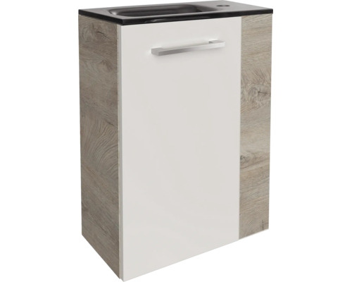 Meuble sous-vasque pour toilettes invités avec façade blanche, côtés aspect bois, poignée argentée et vasque noire intégrée.