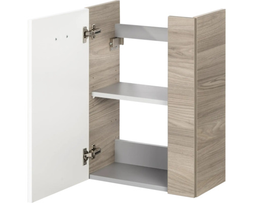 Meuble haut avec corps aspect chêne, porte blanche et une étagère.