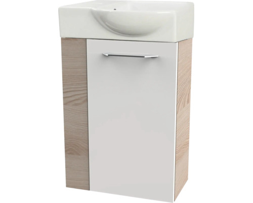 Ensemble lave-mains pour WC d'invités avec vasque en céramique et meuble sous-lavabo aspect chêne avec façade blanche.