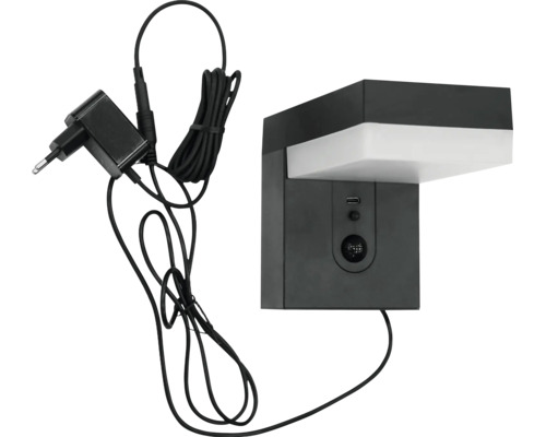 LED-Wandleuchte mit Bewegungsmelder, USB-Anschluss und Netzteil.