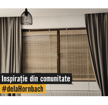 Modernes Fenster mit Bambusrollos, schweren grauen Vorhängen, einer schwarzen Gitter-Hängeleuchte und einem Heizkörper.
