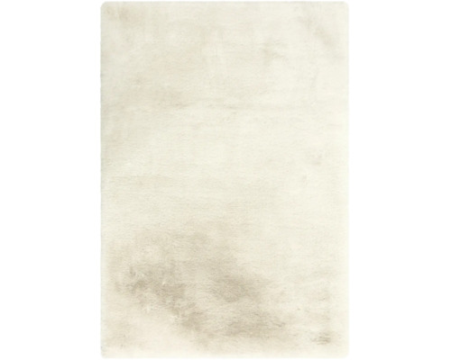 Rechteckiger Hochflor-Teppich in Creme mit weicher, flauschiger Textur.