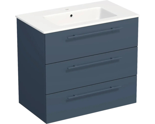 Meuble sous-vasque bleu pétrole avec trois tiroirs et vasque en céramique blanche.