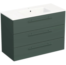 Meuble sous-vasque vert foncé avec trois tiroirs et vasque en céramique blanche.