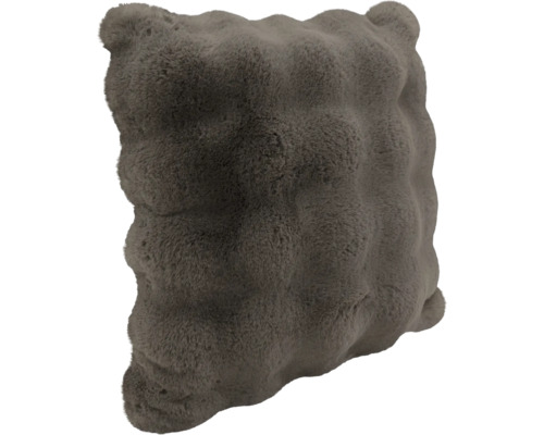 Coussin décoratif carré avec une surface structurée en fausse fourrure douce.
