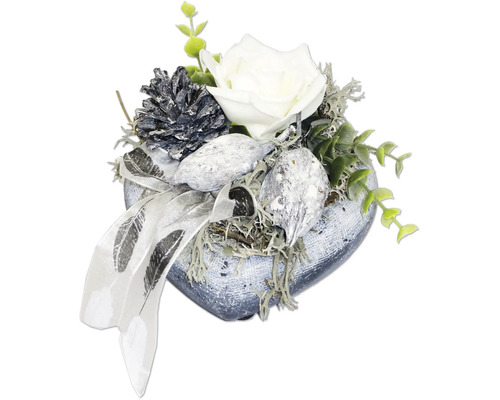 Cœur décoratif avec fleur artificielle, pomme de pin et éléments décoratifs pour table