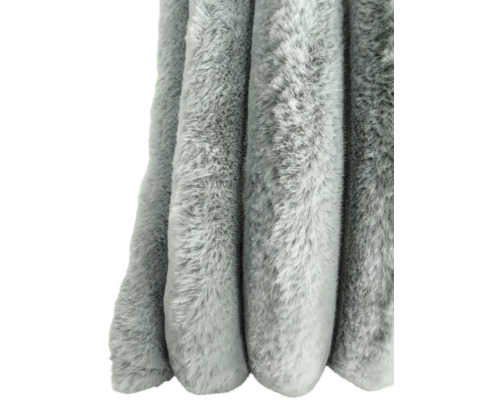 Couverture douce en fausse fourrure avec une surface texturée.