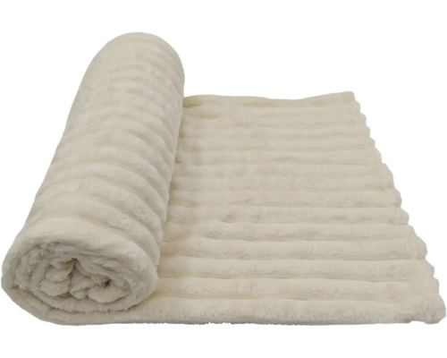 Eine weiche Wohndecke mit gerippter Struktur, teilweise zusammengerollt.
