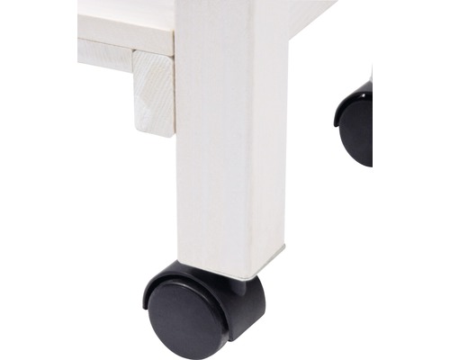 Gros plan sur un pied de meuble blanc avec roulettes